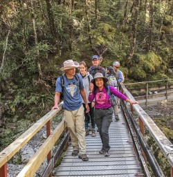 Group on the bridge at Routeburn Track, Otago New Zealand
