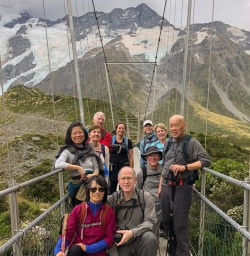 Group on swing bridge at Hooker Valley, Canterbury New Zealand