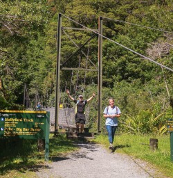 Happy guests at Hollyford Track river, Fiordland New Zealand