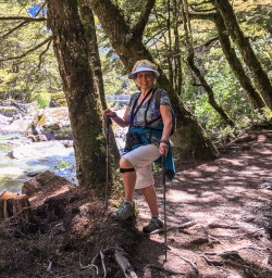 Lady at Routeburn track river, Otago New Zealand