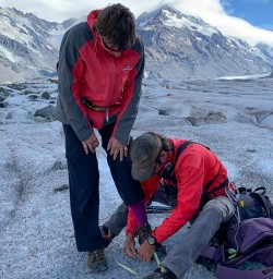 Putting snow shoes at Tasman Glacier, Canterbury New Zealand