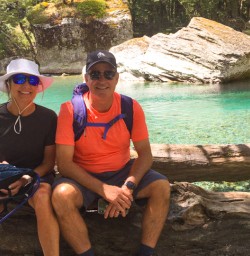 6. Guest couple sitting by river Routeburn Track