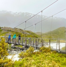 6. Guests crossing bridge Hooker Valley