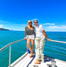 Happy guest couple on boat Kaikoura dolphin swim