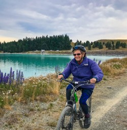 Cycling next to lupins Lake Pukaki