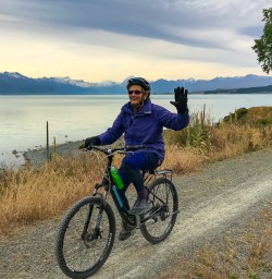 Woman cycling the Alps to Ocean trail
