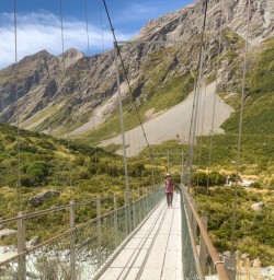 7. Guests crossing swing bridge Hooker Valley Pure South 12 Feb 23