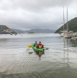 Couple kayaking at Picton, Marlborough New Zealand