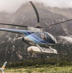 Helicopter taking off at Milford Sound, Fiordland National Park Southland New Zealand