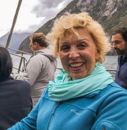 Lady on the boat at Milford Sound, Fiordland New Zealand