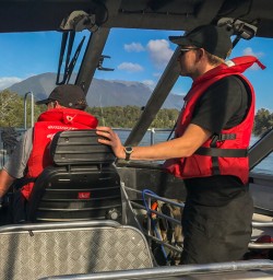 Arriving by Jetboat at Martins Bay Lodge, Fiordland New Zealand
