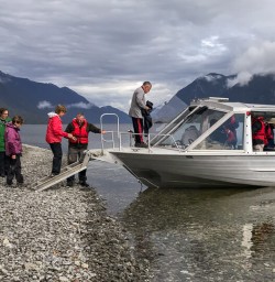 Boarding on jetboat at Hollyford river, Fiordland New Zealand