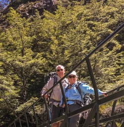 Couple on the bridge at Nelson Lakes National Park, Tasman New Zealand