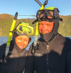 Couple ready to swim with dolphins at Kaikoura, Canterbury New Zealand