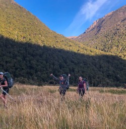 Group walking at Nelson Lakes National Park, Tasman New Zealand