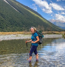 Guest crossing Travers river at Nelson Lakes National Park, Tasman New Zealand