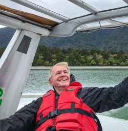 Guest enjoying boat through Milford Sound