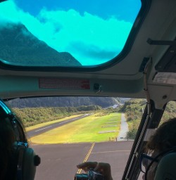 Helicopter taking off at Milford sound, Fiordland New Zealand