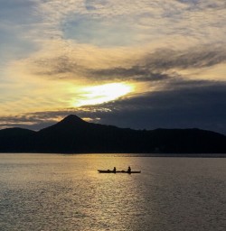 Kayaking in sunset at Abel Tasman National Park, New Zealand
