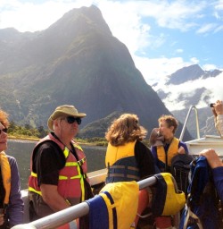 hikers cruising across milford sound to the milford track