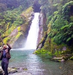 hiker at milford track falls