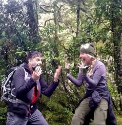 happy hikers at milford track new zealand