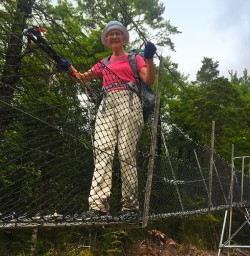 Getting to grips with a wire bridge acroos a creek. Nelson Lakes National Park.