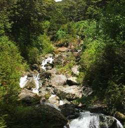 Waterfalls cascading down the hillside. 