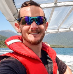 Guide selfie on Jetboat at Lake Mckerrow, Fiordland New Zealand