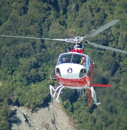 Helicopter flying into Fox Glacier