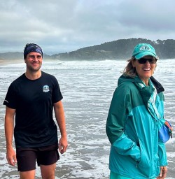 Guest and guide enjoying hot water beach 210125