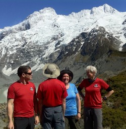 Hikers at the Mt Sefton and Mueller Glacier Lake viewpoint