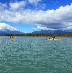 Kayaking with mountain backdrop