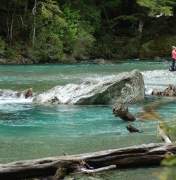 Hikers relaxing by the Routeburn River