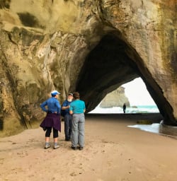 2 Guests admire Cathedral Cove archway