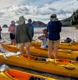 2 Group Preparing for Guided Kayak Adventure at Cathedra Cove March2025