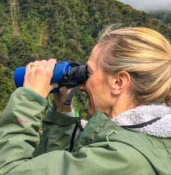 Guest using binoculars Milford Sound