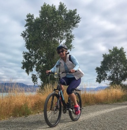 Guest biking along Lake Pukaki, Canterbury New Zealand