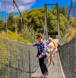 1. Guests crossing bridge on the Arrowtown to Gibbston trail