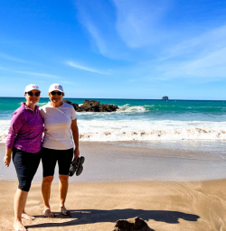 2. Two happy guests on beach