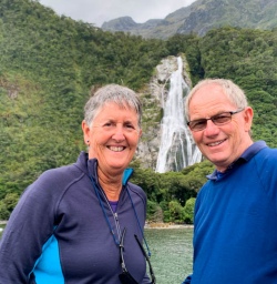 3 Smiling guests at Bowen Falls Milford Sound Cruise
