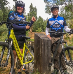 Couple biking the Arrow River Bridge Ride, Otago New Zealand