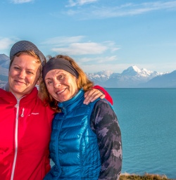 Guests  at Lake Pukaki with Aoraki Mount Cook in the background, Canterbury New Zealand