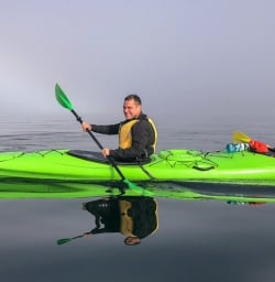 Couple kayaking at Marlborough Sounds, New Zealand