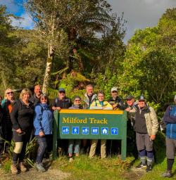Group pic with the Milford Track sign