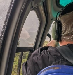 Helcopter taking off at Milford Sound, Fiordland New Zealand