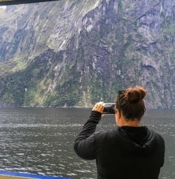 Taking pictures of Stirling Falls, Milford Sound Fiordland Southland New Zealand