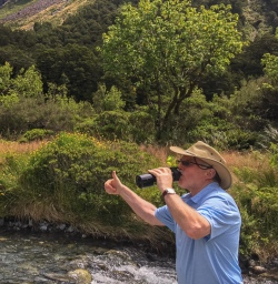 Drinking natural water at Monkey Creek, Fiordland New Zealand