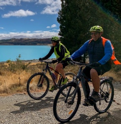 Couple biking along Lake Pukaki, Canterbury New Zealand