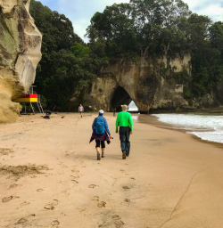 2 Guests stroll the beach at Cathedral Cove